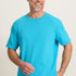 Man wearing a bright blue t-shirt against a plain background