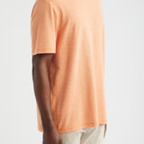 Person wearing an orange t-shirt on a white background