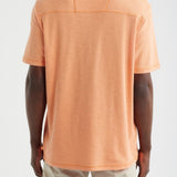 Person wearing an orange t-shirt on a white background