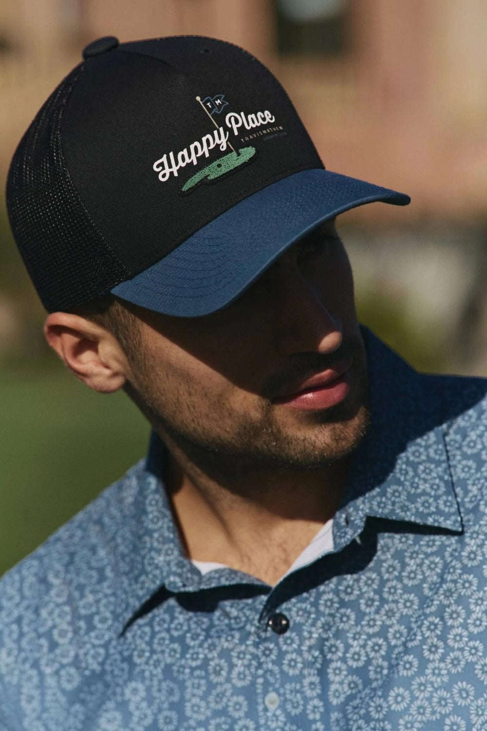 The SWING SEASON HAT leans into that stretch of the year everyone waits for, pairing a breezy two-tone mesh snapback with golf-inspired art and a subtle grass embroidery detail that rewards a closer look. Light, easy, and unmistakably on trend, it’s the hat that says the good rounds are just getting started.
