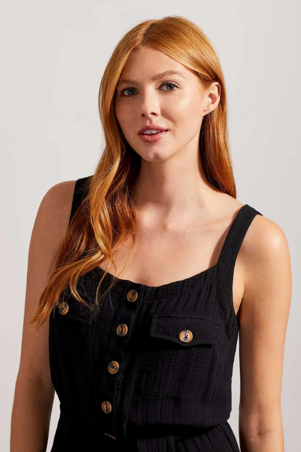 Nail that one-and-done look and instantly revive your warm-weather style by slipping into this sleeveless jumpsuit flaunting little bits of flair and a comfortable fit. We're crushing on the button-front bodice framed by patch pockets, dainty spaghetti straps, 25" inseam, and crinkled gauze fabric that offers lightweight coverage.