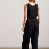 Nail that one-and-done look and instantly revive your warm-weather style by slipping into this sleeveless jumpsuit flaunting little bits of flair and a comfortable fit. We're crushing on the button-front bodice framed by patch pockets, dainty spaghetti straps, 25" inseam, and crinkled gauze fabric that offers lightweight coverage.