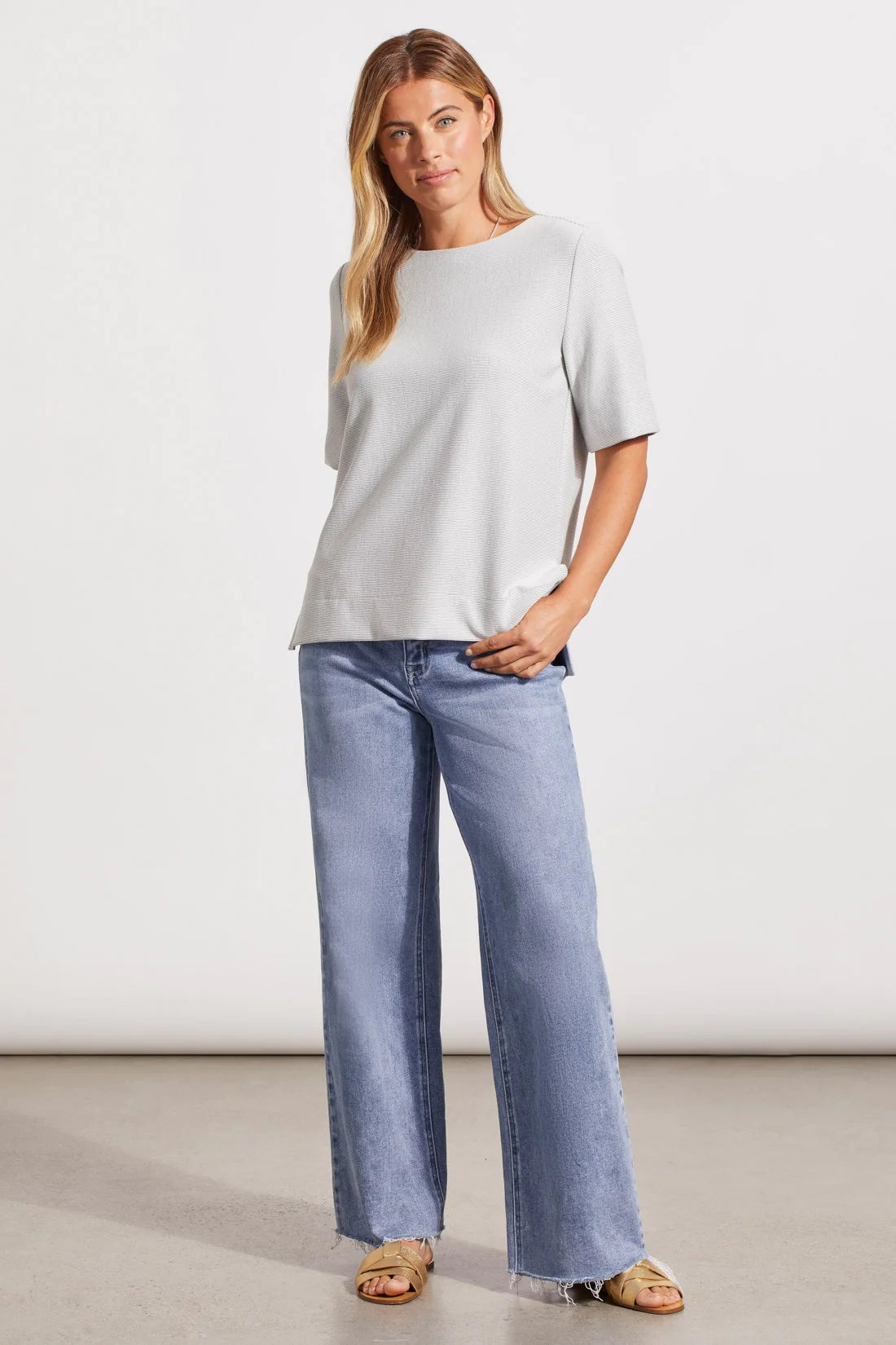 Ottoman knit fabric with a textured finish and two-way stretch delivers style-forward comfort to this top.