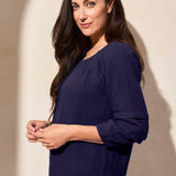 Soak up the sunshine in this breezy off-shoulder top, or transform your look by adjusting the neckline for extra coverage with its convertible design. Crafted from breathable cotton gauze with a subtle crinkle finish, this top stays wrinkle-free for easy wear. The long puff sleeves feature striking details and end in a fitted hem that can be effortlessly pushed back for a more relaxed vibe.