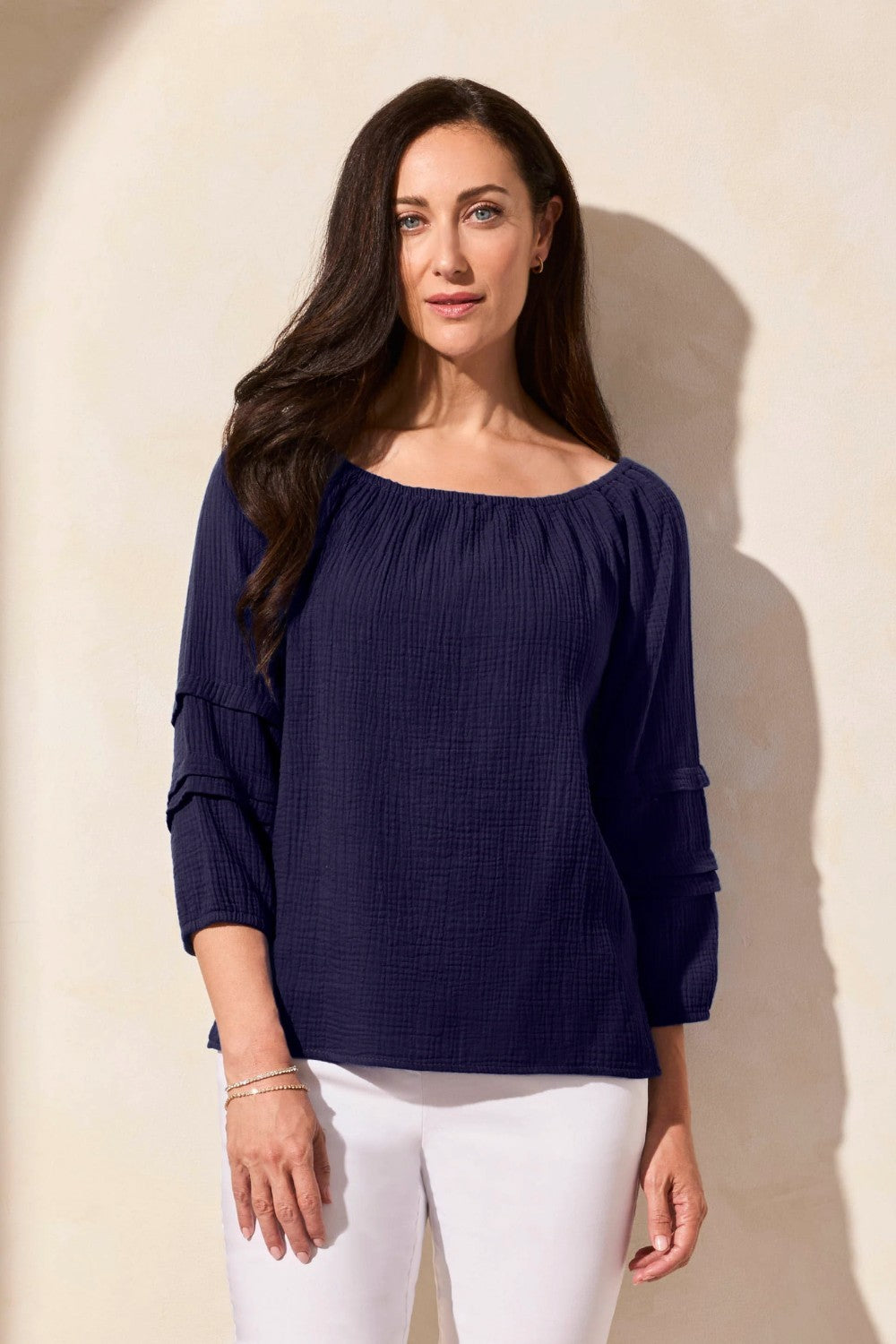 Soak up the sunshine in this breezy off-shoulder top, or transform your look by adjusting the neckline for extra coverage with its convertible design. Crafted from breathable cotton gauze with a subtle crinkle finish, this top stays wrinkle-free for easy wear. The long puff sleeves feature striking details and end in a fitted hem that can be effortlessly pushed back for a more relaxed vibe.