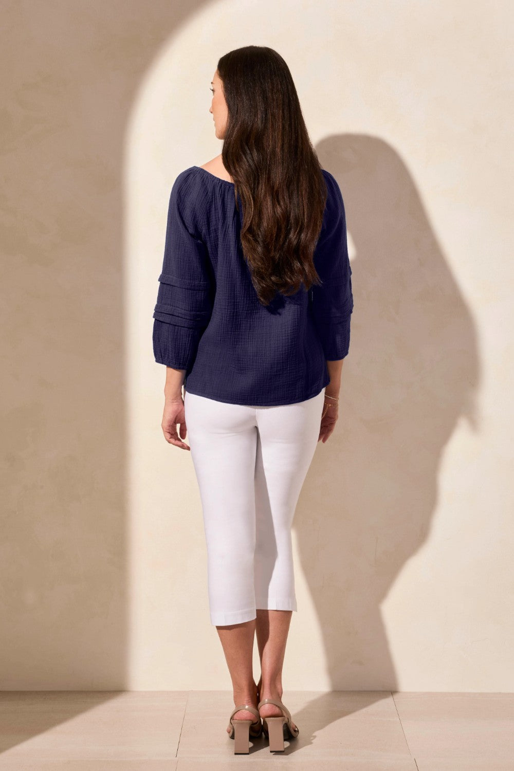 Soak up the sunshine in this breezy off-shoulder top, or transform your look by adjusting the neckline for extra coverage with its convertible design. Crafted from breathable cotton gauze with a subtle crinkle finish, this top stays wrinkle-free for easy wear. The long puff sleeves feature striking details and end in a fitted hem that can be effortlessly pushed back for a more relaxed vibe.