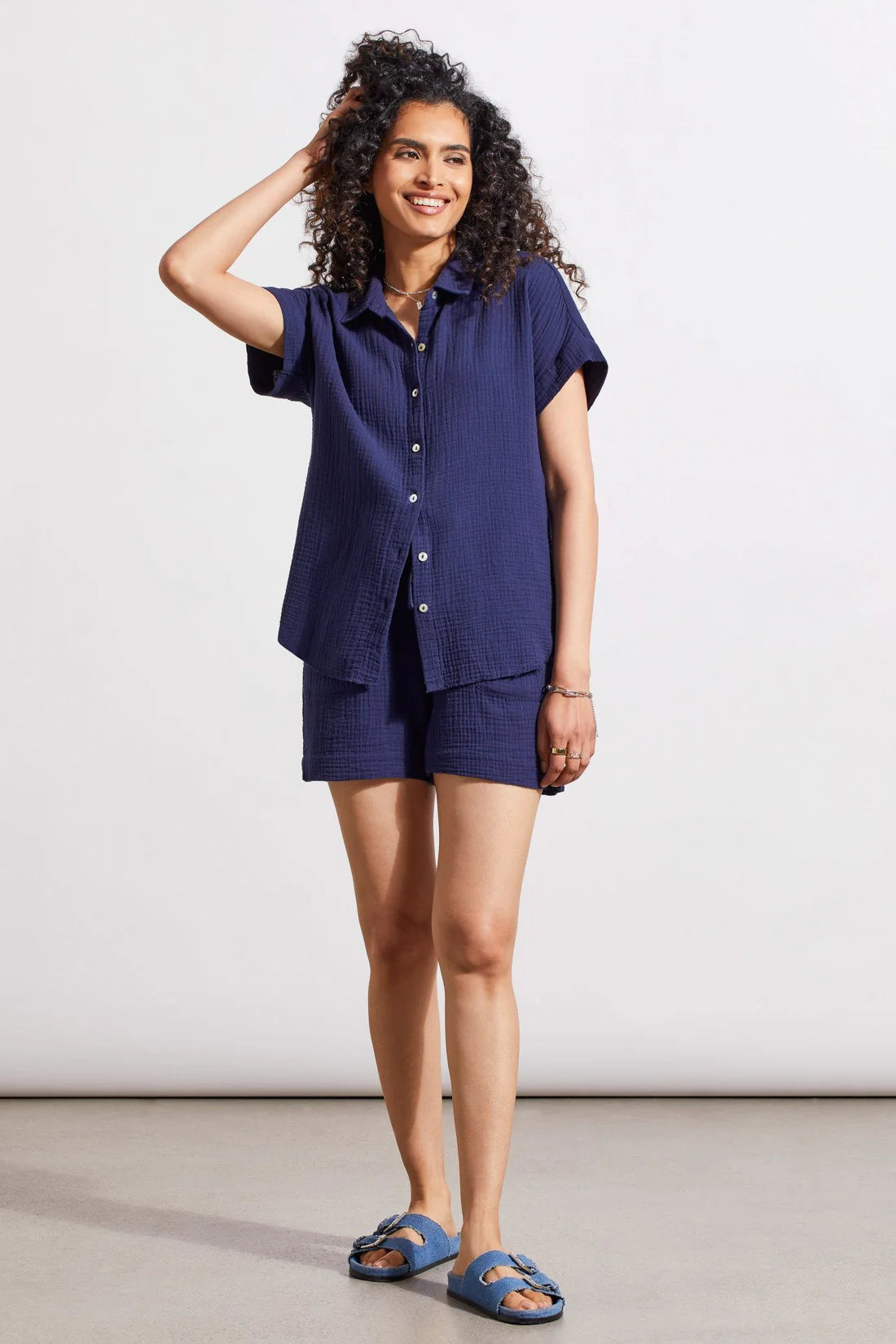 Rocking a classic button-up front, collared neckline, and short sleeves, this shirt brings refined style to warm days. We love the airy dolman design, rolled cuffs, raw-edge hem, and crinkled gauze cotton that stays lightweight from morning until night.