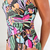 Colorful tropical patterned swimsuit on a white background