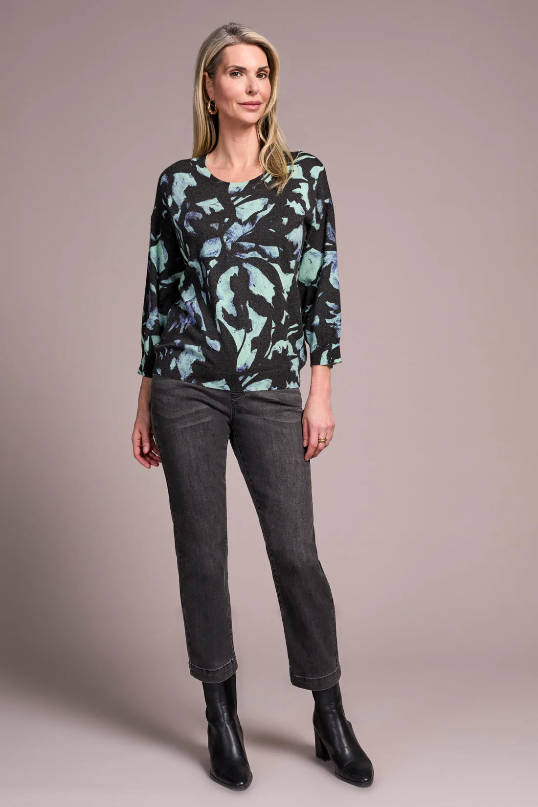 Opt for this relaxed crewneck sweater when you desire casual coziness in a soft yarn blend. The all-over floral print adds an uplifting touch to your look, while drop shoulders enhance comfort and ease of movement. Three-quarter-length sleeves provide the perfect amount of coverage.