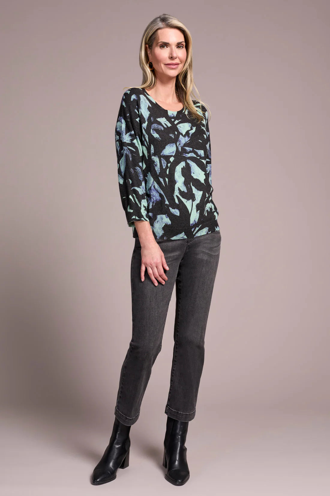 Opt for this relaxed crewneck sweater when you desire casual coziness in a soft yarn blend. The all-over floral print adds an uplifting touch to your look, while drop shoulders enhance comfort and ease of movement. Three-quarter-length sleeves provide the perfect amount of coverage.