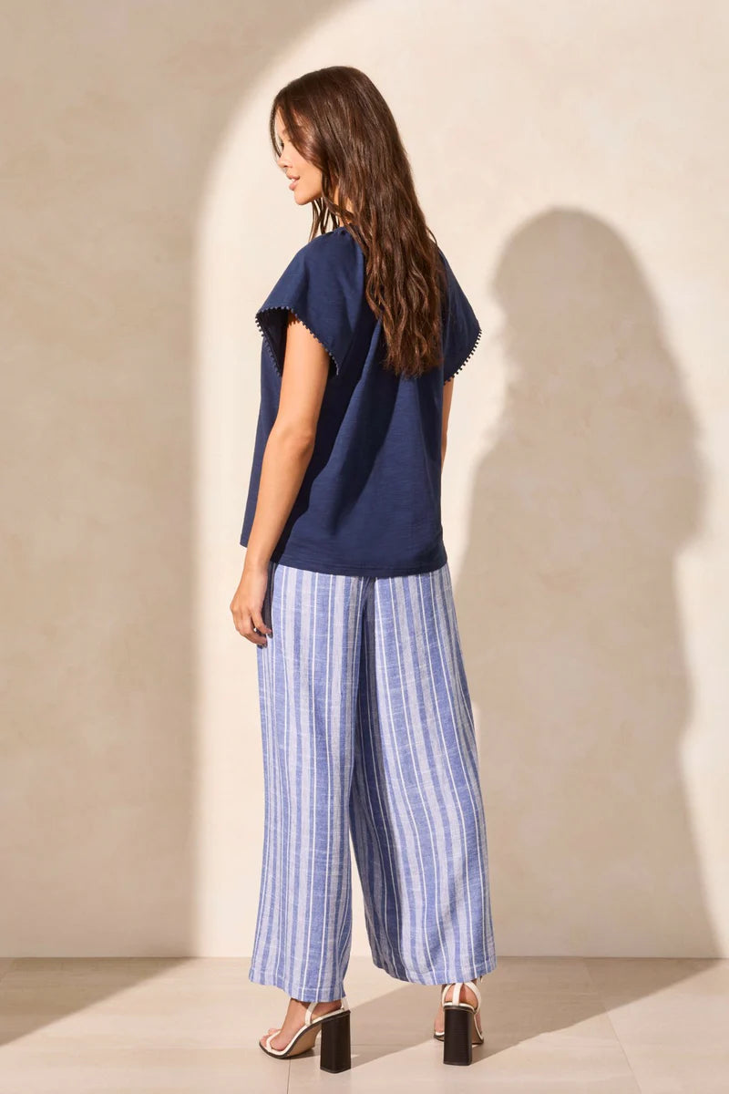 Infuse your look with effortless boho charm in this short-sleeve top, featuring a notch neckline with tassel-tipped ties. Made from soft cotton slub knit, it offers a breathable, comfortable feel. A contour band accentuates the neckline, while braided edge trim adds a refined touch to the design.