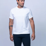 Man wearing a white t-shirt and navy shorts on a light gray background