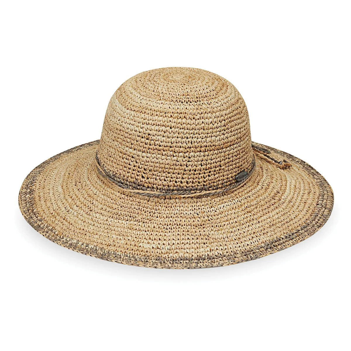 The Wallaroo Camille hat will be your first pick when getting ready for a picnic with friends or lounging by the pool. Made with 100% raffia, this wide brimmed straw hat stays cool and comfortable on a hot summer day.