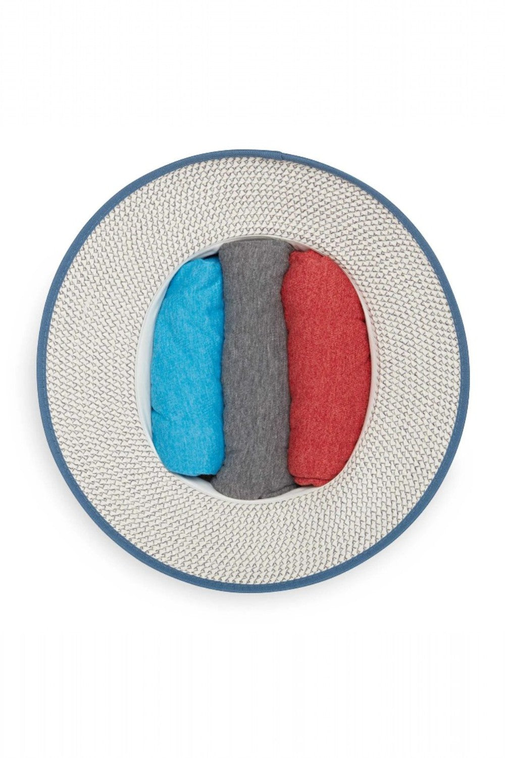 Inside of hat stuffed with three shirts to hold shape for packing
