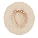 Beige hat with a ribbon on a white background