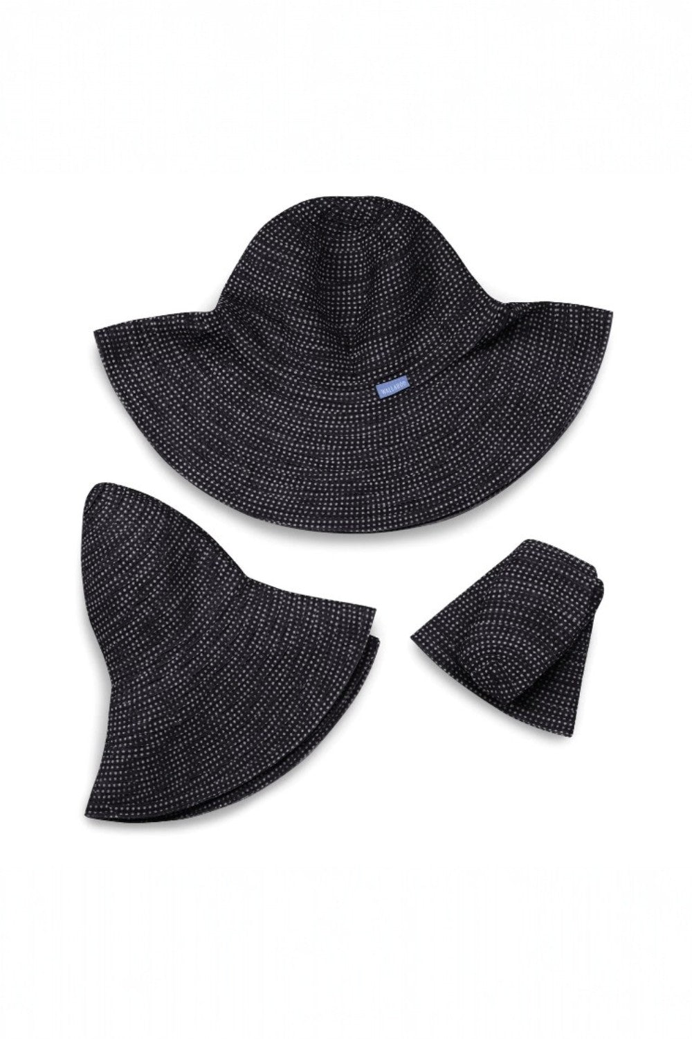 Black and white sun hat folded on a white background