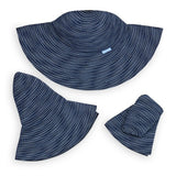 Navy and white sun hat folded on a white background