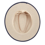 Beige hat with navy band on a white background
