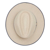 Beige hat with navy rim on a white background
