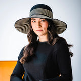 Stripes are always in style. From the beach to the runway, this hat adds a touch of class to any event. Flexi-Weave fabric keeps it looking great.