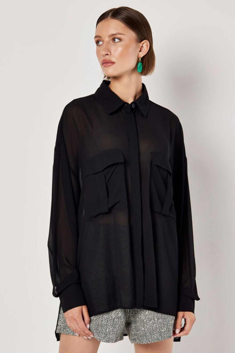 Cut from lightweight chiffon to an oversized fit designed to create a free-flowing silhouette, this shirt is the perfect pick for both on and off-duty dressing. Framed by a collared neckline and long sleeves, it boasts a concealed button placket, twin chest patch pockets, and a dipped hem. Tuck into tailored shorts or style with jeans when the weekend arrives.