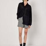 Cut from lightweight chiffon to an oversized fit designed to create a free-flowing silhouette, this shirt is the perfect pick for both on and off-duty dressing. Framed by a collared neckline and long sleeves, it boasts a concealed button placket, twin chest patch pockets, and a dipped hem. Tuck into tailored shorts or style with jeans when the weekend arrives.