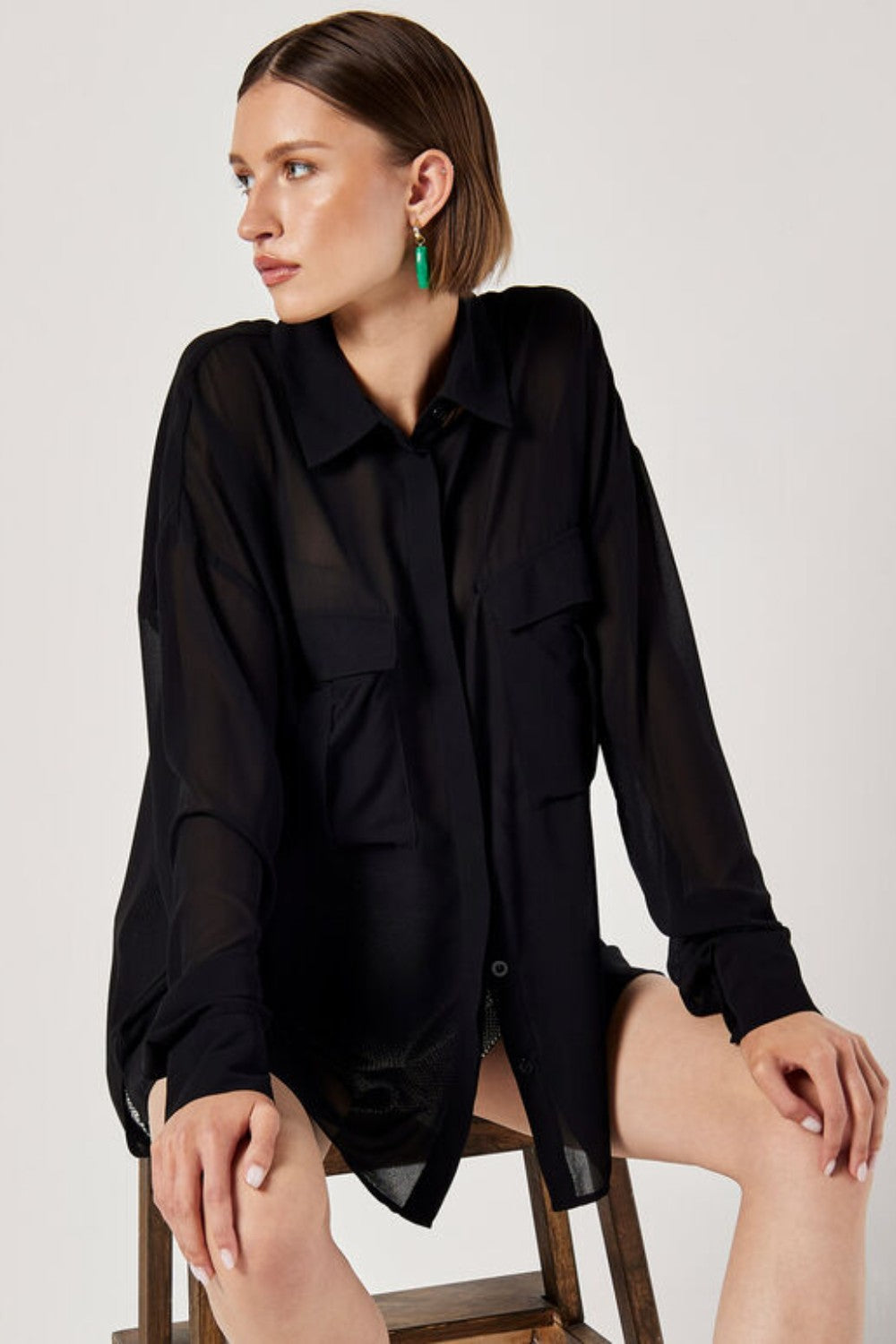 Cut from lightweight chiffon to an oversized fit designed to create a free-flowing silhouette, this shirt is the perfect pick for both on and off-duty dressing. Framed by a collared neckline and long sleeves, it boasts a concealed button placket, twin chest patch pockets, and a dipped hem. Tuck into tailored shorts or style with jeans when the weekend arrives.