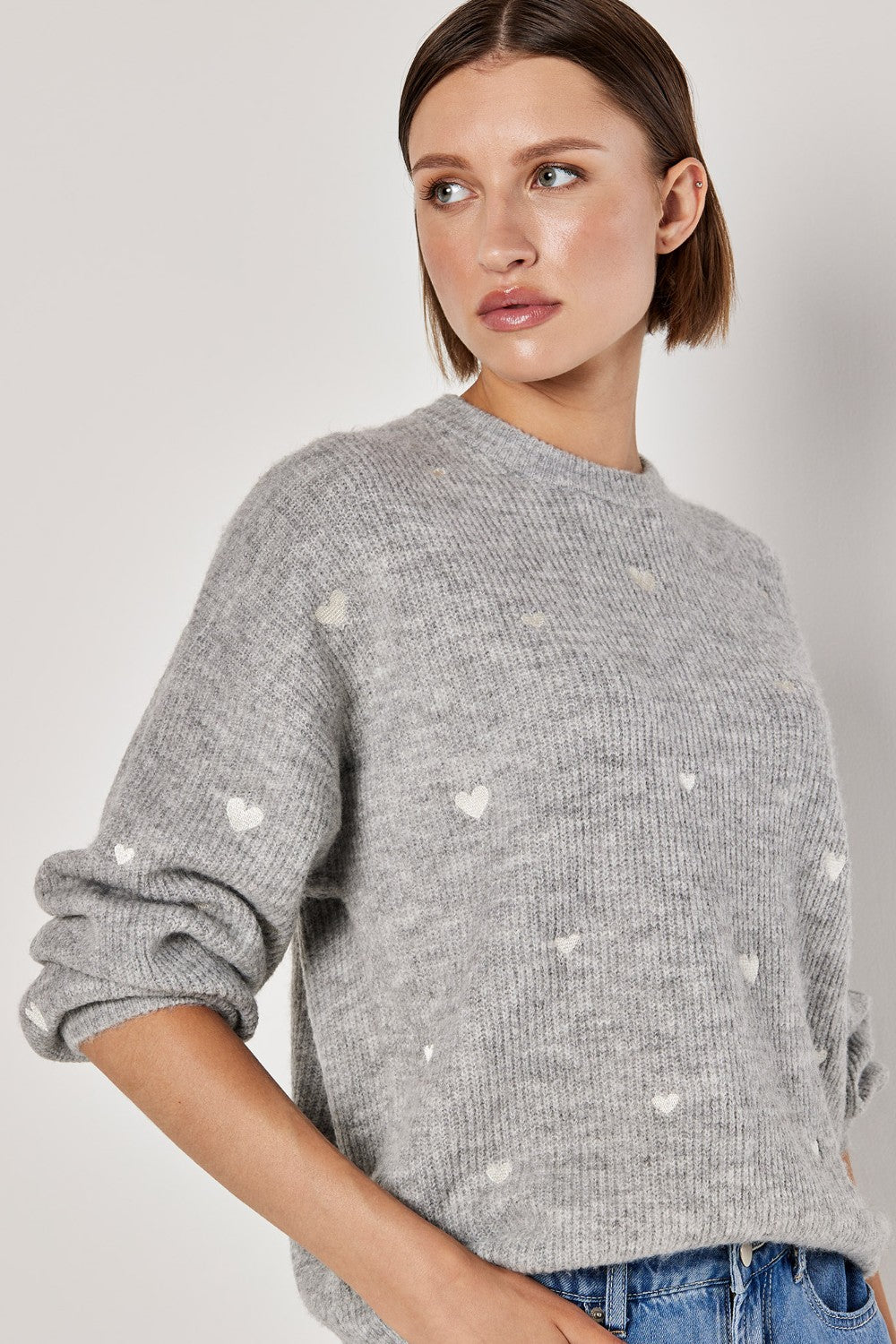 This Apricot Embroidered Heart Sweater is the perfect mood enhancer with its sweet design. Made with high-quality materials, it will bring a touch of charm to any outfit. Embrace the playful yet stylish vibe of this sweater and elevate your wardrobe.