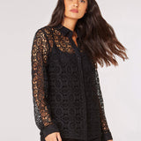 This unique Apricot Geometric Guipure Lace Shirt is sure to turn heads! Featuring an intricate geometric pattern, the luxurious lace is classic black for a timeless look. 