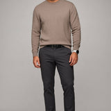 Broderick's Clothing Co. Au Noir LACAUNE beige cashmere crew neck sweater worn by a man with dark trousers and boots.