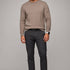 Broderick's Clothing Co. Au Noir LACAUNE beige cashmere crew neck sweater worn by a man with dark trousers and boots.
