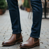 Broderick's Clothing Co. Florsheim Lodge brown leather Chelsea boots worn with dark blue jeans on a cobblestone street
