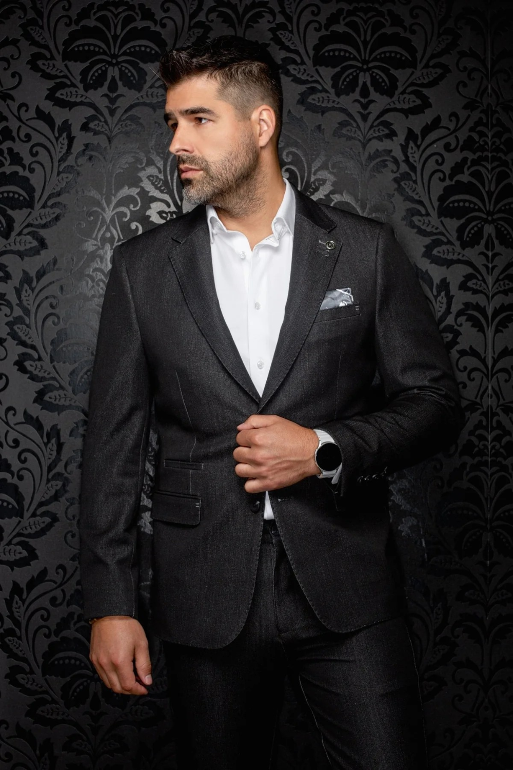 Broderick's Clothing Co. Au Noir charcoal grey single-breasted blazer with flap pockets worn by a man in a white shirt