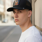 Broderick's Clothing Co. Goorin Bros. black trucker hat with a Doberman patch worn by a man in a white t-shirt