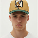 Broderick's Clothing Co. Goorin Bros. tan and green trucker hat with a fish patch worn by a male model