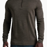 Model wearing a Broderick's Clothing Co. KÜHL INVIGORATR olive green merino wool quarter-zip athletic pullover