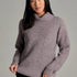 Broderick's Clothing Co. KÜHL Sienna heathered mauve chunky knit sweater with a ribbed cowl neck and raglan sleeves.