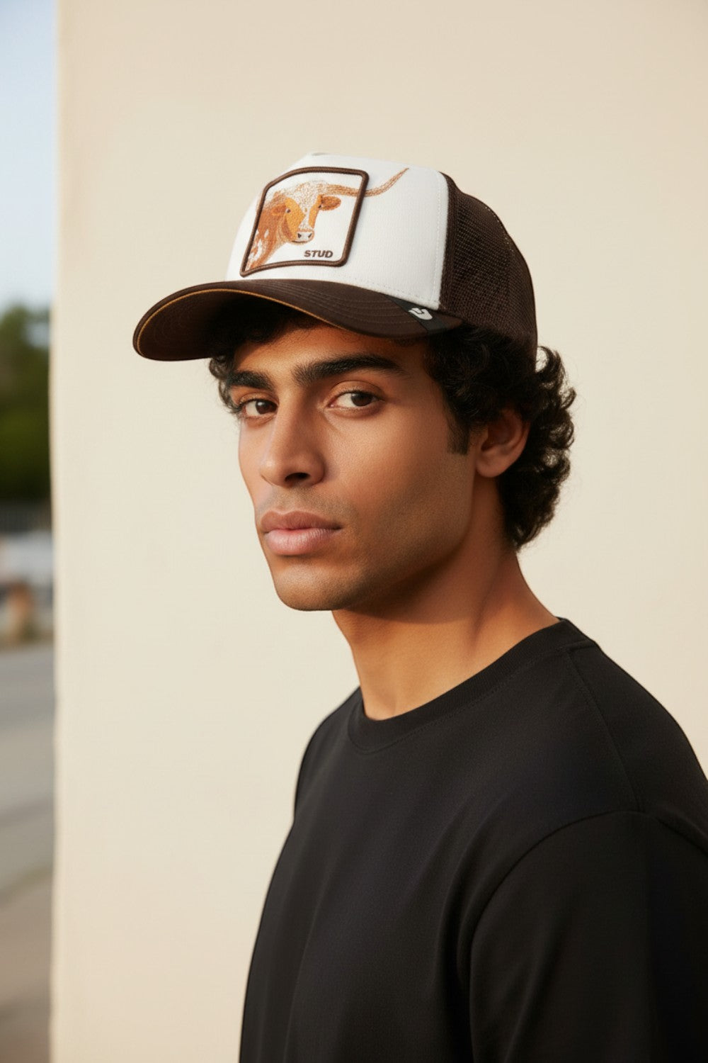 Broderick's Clothing Co. Goorin Bros. brown and white trucker hat with longhorn patch worn by a young man