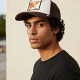 Broderick's Clothing Co. Goorin Bros. brown and white trucker hat with longhorn patch worn by a young man