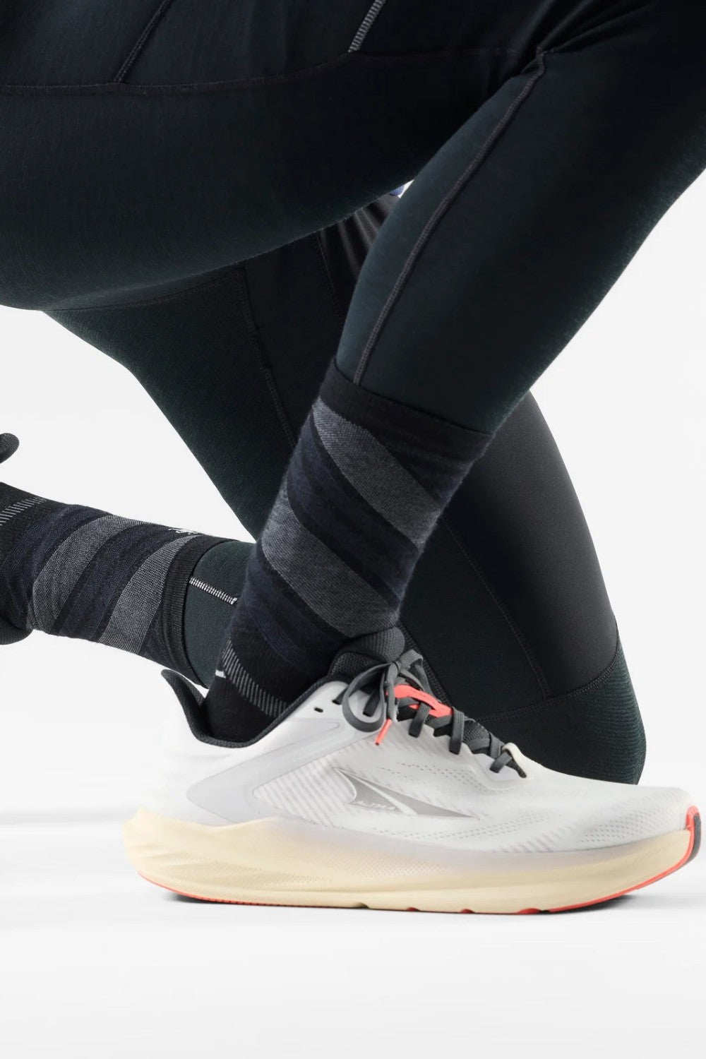 Broderick's Clothing Co. Smartwool Merino wool crew running socks with black and grey striped pattern on a runner