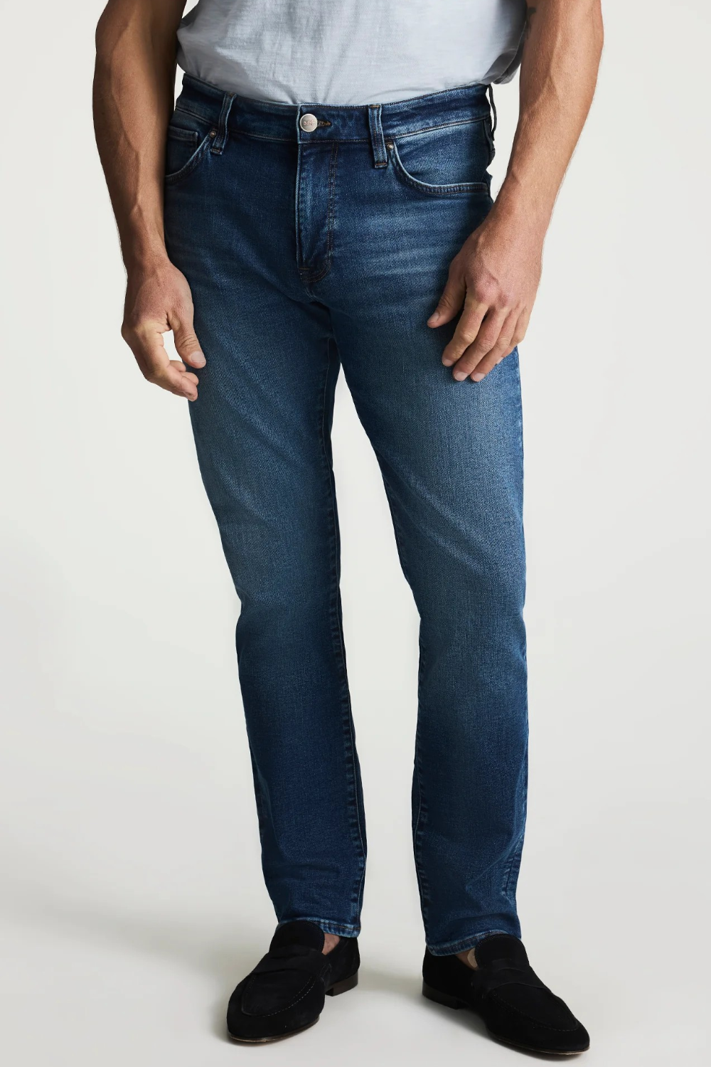 Broderick's Clothing Co. 34 Heritage medium blue tapered leg jeans with contrast stitching and vintage denim texture