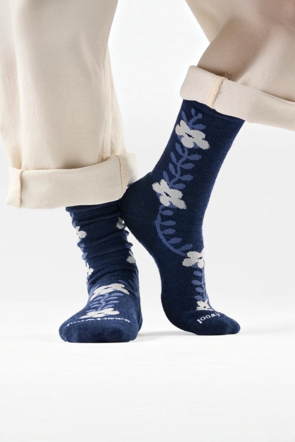 Broderick's Clothing Co. navy blue Merino wool crew socks featuring a white garden vine floral pattern on feet