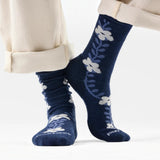 Broderick's Clothing Co. navy blue Merino wool crew socks featuring a white garden vine floral pattern on feet