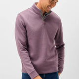 Broderick's Clothing Co. purple diamond quilted henley pullover with suede placket details worn by a smiling man