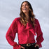 Broderick's Clothing Co. red sheer chiffon blouse with polka dot texture, bow-tie neck, and ruffled long sleeves.