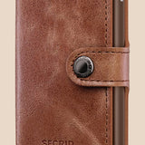 Broderick's Clothing Co. Secrid Miniwallet in vintage cognac-brown leather with an integrated aluminium card protector.