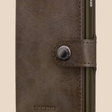 Broderick's Clothing Co. Secrid Miniwallet in vintage oak brown leather with a secure snap button and card protector.