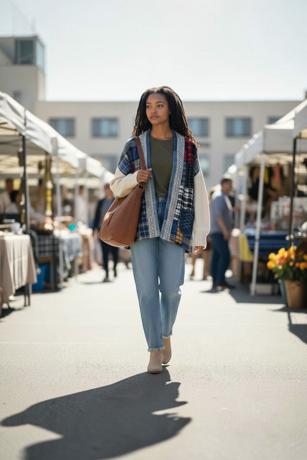 Broderick's Clothing Co. Shannon Passero Addison patchwork cardigan with plaid patterns and cream knit sleeves.