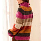 Broderick's Clothing Co. multi-colored striped bouclé turtleneck sweater with a relaxed fit on a female model.