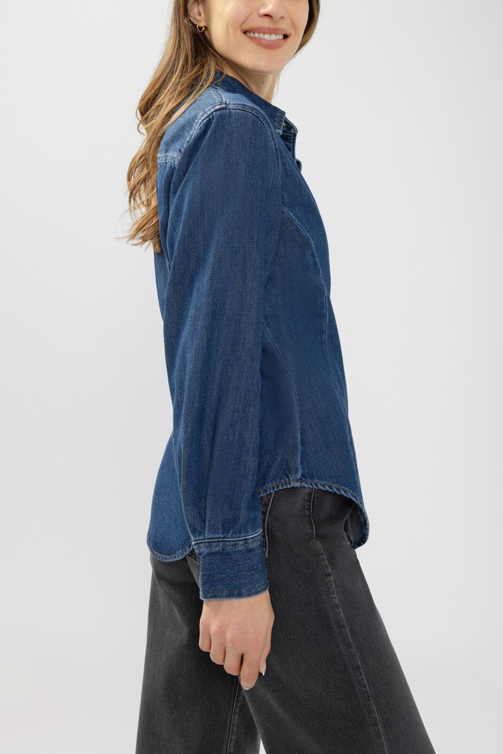 Broderick's Clothing Co. Angie denim shirt in medium-wash blue with princess seams and a relaxed fit on a model